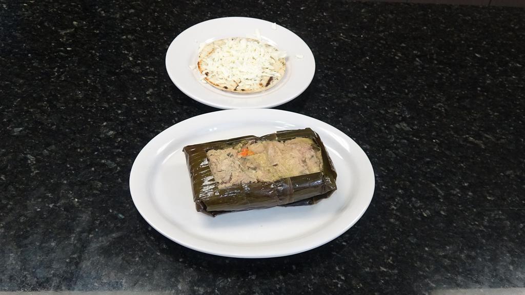 Tamal Valluno con Arepa con Queso · Corn cake with cheese and hot chocolate or coffee.