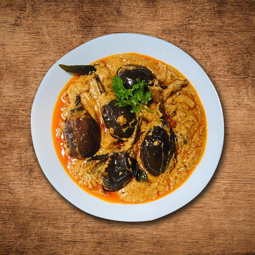 Just Eggplant Special Curry · Eggplant roasted in a tandoor and pureed cooked with fresh tomatoes, green peas, onions, spices.
 