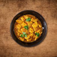 United Chicken Curry  · Tender morsels of chicken cooked in a classic brown curry with Indian whole spices.
