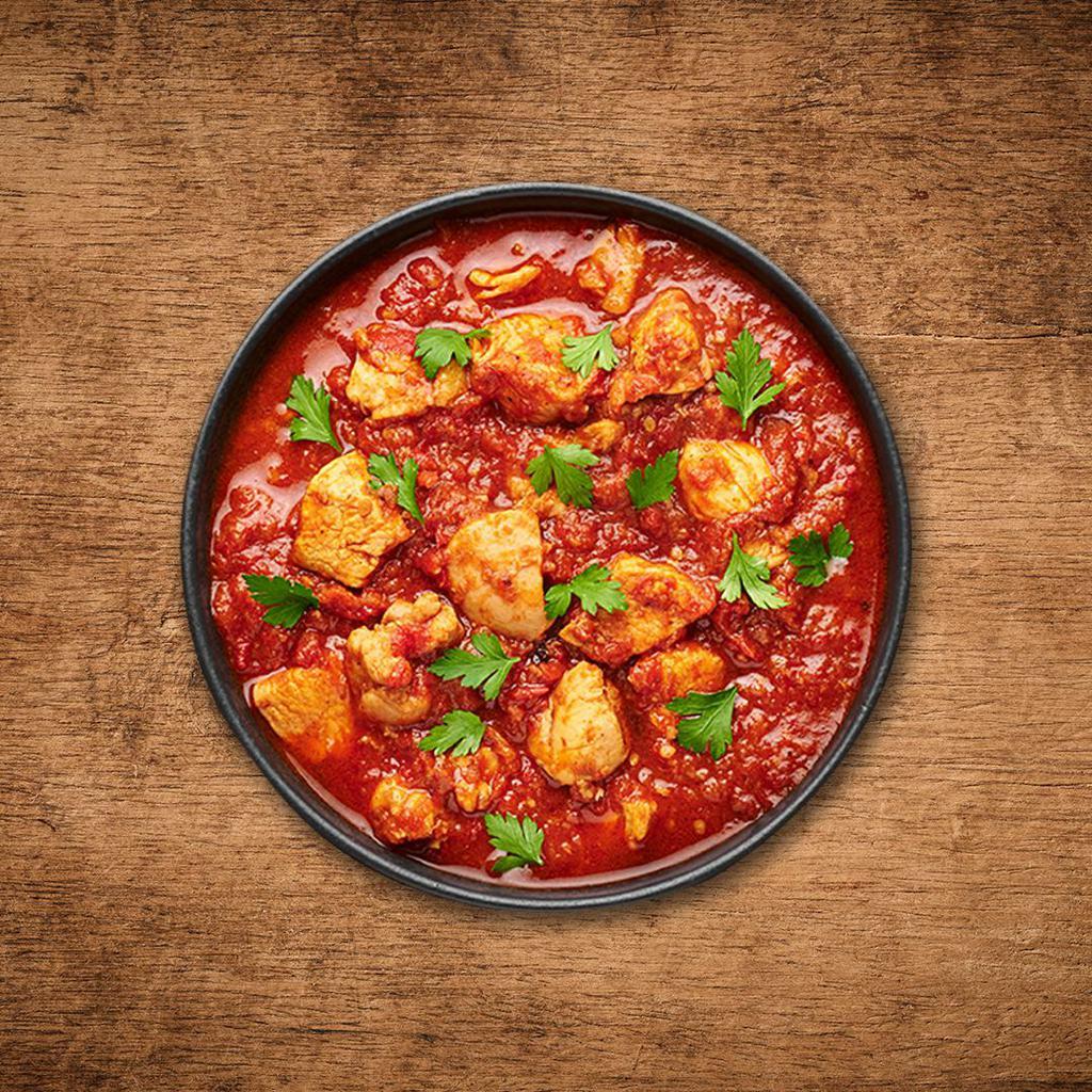 Chicken Vulcan Vindaloo  · A special from the coastal state of Goa, boneless morsels of chicken, slow cooked in a hot and tangy  traditional red 'rechado' masala.
