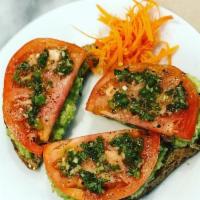 Avocado Toast · organic avocado, organic tomato, red onion basil with organic chimichurri drizzled on top of...