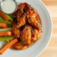 Chicken Wings · 1 lb. served with ranch or blue cheese, Choice of: buffalo, BBQ, or chili cilantro