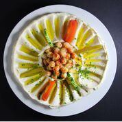 6. Hummus · Wally’s homemade hummus is so good you’ll want to bring some home! Mashed chickpeas blended ...