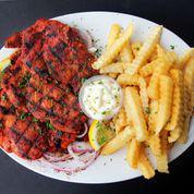 29. Spicy Musahab Chicken Plate · Spicy pita bread topped with spicy grilled chicken thigh marinated in Wally’s very own hot spice blend sauce. Served with 1 garlic sauce and your choice of 1 option of yellow rice or fries or hummus or 2 pita bread.