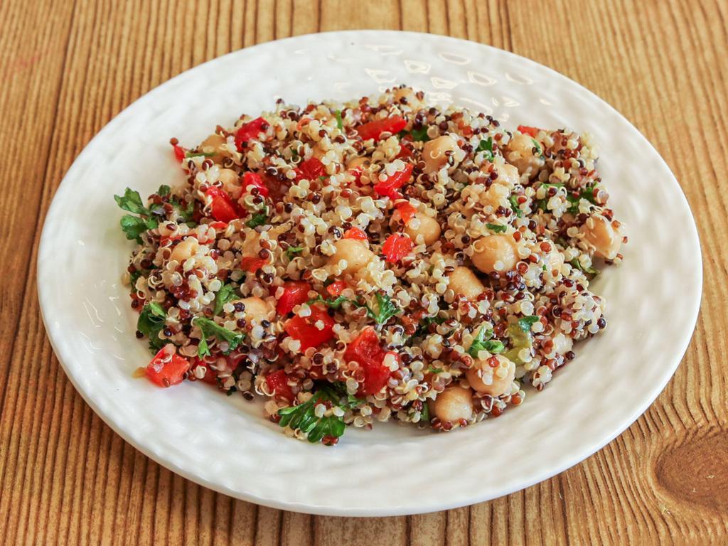 Quinoa Salad · Our amazing middle eastern quinoa salad made with quinoa, chickpeas, cucumber, bell pepper, red onion, parsley, and a little garlic.