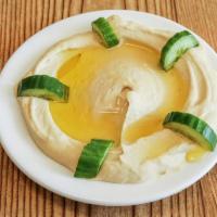 Hummus  · A serving of our famous middle eastern hummus! Hummus is made of smashed chick peas, tahini,...