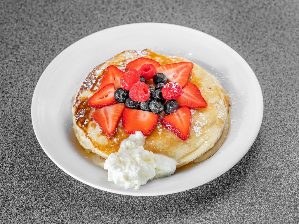 Lemon Ricotta Pancakes with Honey and Berries · Topped with mix berries and honey.
