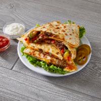 Steak Quesadilla · Tender grilled steak and green and red peppers smothered with melted mozzarella and cheddar ...