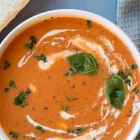 Tomato Basil Bisque · House-made creamy bisque with plenty of basil.