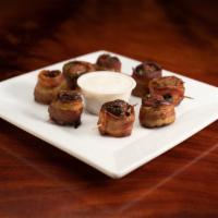 Dragon Bites · Jalapenos stuffed with prime Italian sausage and wrapped in bacon. Spicy!