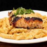 Blackened Salmon  Pasta · Blackend Salmon Fillet on top of Creamy Parmesan Alfredo Sauce with sauteed tri-colored bell...
