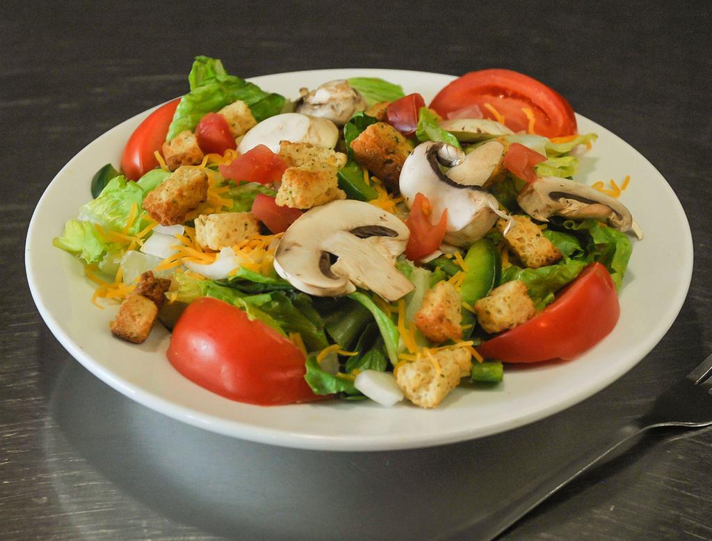 Garden Salad · Romaine lettuce, onions, green peppers, tomatoes, mushrooms, and croutons with your choice of ranch, Bleu cheese, italian, creamy garlic, caesar, or a honey mustard dressing.