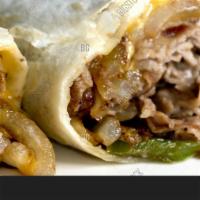 Philly Steak & Cheese on Wrap · Grilled Philly steak with onion, mushroom, and green pepper with melted provolone cheese.
