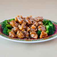 H3. Sesame Chicken · Chicken chunks garnish with fresh broccoli with sesame seeds sprinkled on top.