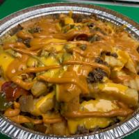 Philly Fries · Fries topped with philly cheesesteak, wiz, peppers, onions, and chipotle aioli sauce.