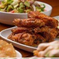 Abbey Wings · Choice of sauce, Buffalo, old bay, spicy soy sesame and tangy BBQ.