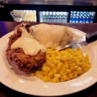 Raya's Chicken Fried Chicken · Just like Grandma’s, hand breaded chicken breast, fresh mashed potatoes, and corn, topped wi...