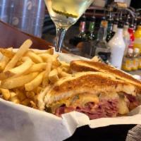 Tommy's Reuben · Sliced corned beef brisket, our dill sauerkraut, melted Swiss cheese, fried pickles and thou...