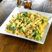 Pasta with Chicken Broccoli Alfredo · Chicken tenders sauteed with fresh broccoli, touch of garlic, butter, Alfredo sauce over zit...