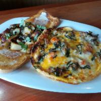 Rocco’s Favorite Frittata · Italian Sausage, Tomatoes, Onion, basil and 3 Cheeses. Served with breakfast potatoes and to...