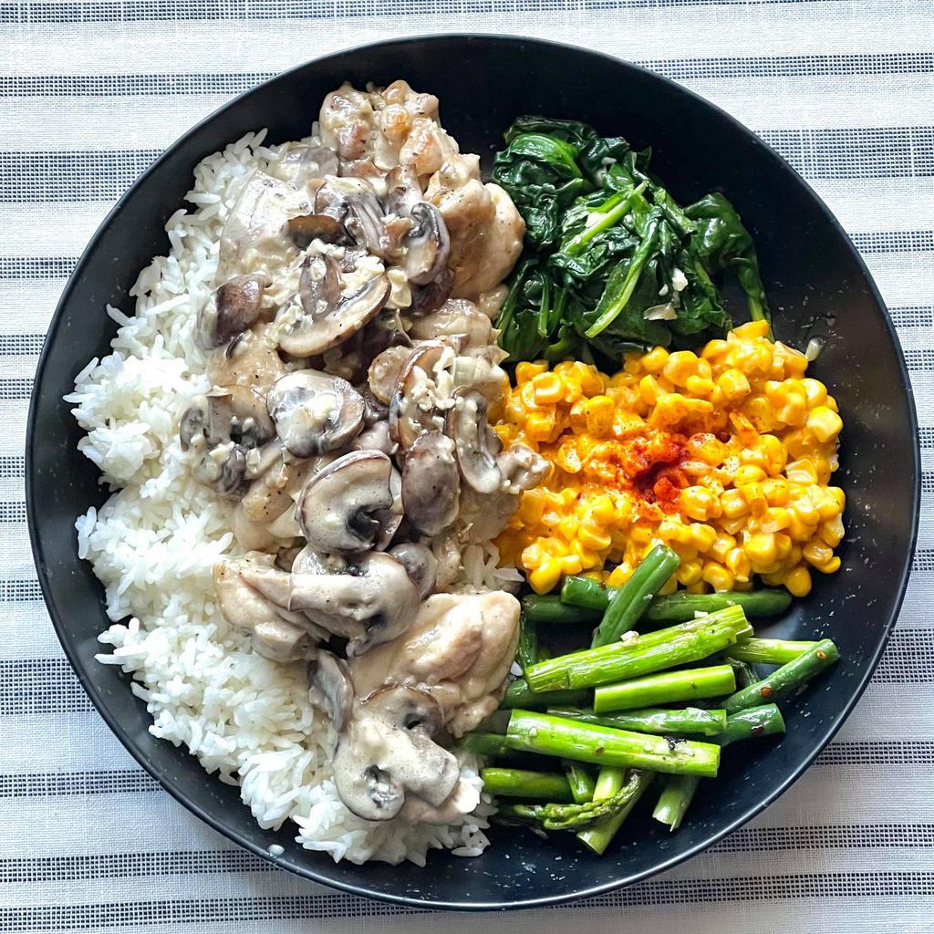 Mushroom Cream Chicken Plate · House special butter mushroom cream chicken with hint of thyme and garlic. Served over rice with a side of creamed corn and garlic butter spinach tomatoes.