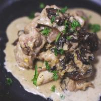 Mushroom Cream Chicken · House special butter mushroom cream chicken with hint of thyme and garlic, garnished with pa...