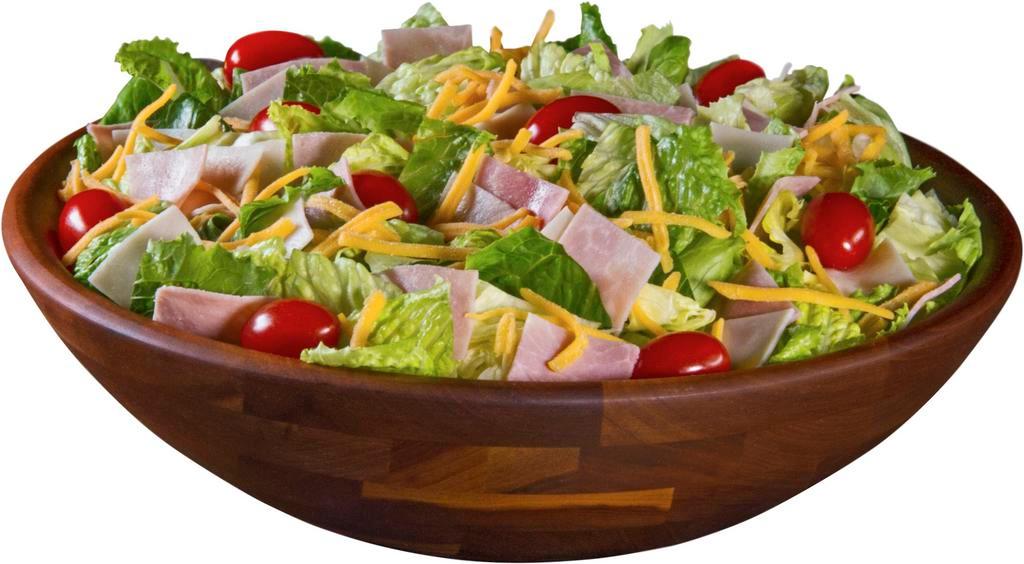 Chef Salad · Lettuce, Turkey, Ham, Cheddar Cheese, and Tomatoes.