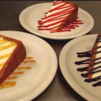 New York Cheesecake · Smooth and rich. Served with choice of ghirardelli chocolate, raspberry or caramel sauce.