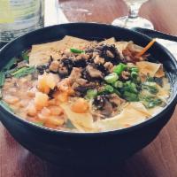 Vegetarian Rice Noodle Soup 山珍素米线 · Rice noodle in vegetarian soup broth, topped with fried tofu, black mushroom, tofu skin, car...