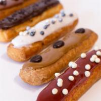 Eclair  · An indulgent dessert, eclairs are made with light and airy choux pastry dough, filled with r...
