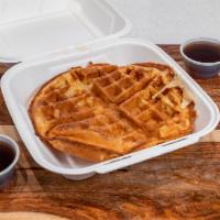 Belgian Waffle · Sweet golden brown waffle served with melted butter and hot syrup.