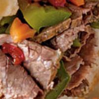 Chicago Style Italian Beef Sub · Slow roasted beef dipped in au jus topped with peppers, onions, giardiniera, hot cherry pepp...