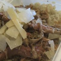 Italian Pulled Pork with Risotto · Italian style pulled pork served over a bed of risotto topped with Parmigiana cheese.