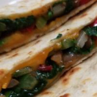 Vegetarian Quesadilla (V) · Grilled mushrooms, spinach, peppers, onions and cheddar cheese served with sour cream