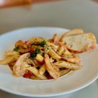 Cajun Shrimp Pasta  · Shrimp | red peppers | red onions | penne pasta | creamy cajun sauce 