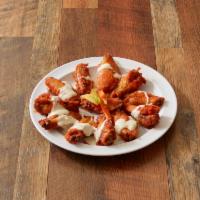 Buffalo Chicken Wings · 10 pieces served with choice of sauce, celery, carrots and bleu cheese.