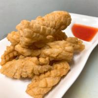 Golden Calamari · Crispy calamari in tempura batter, served with tasty sauce.