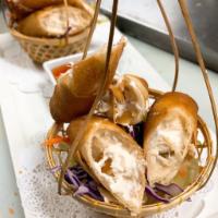 Crunchy Crab Cheese Roll · Crispy fried crab meat mixed with cream cheese wrapped in egg roll skin, served with sweet &...