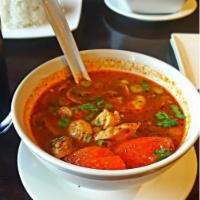 Tom Yum · Most popular Thai spicy hot and sour soup with fresh mushrooms, lemon grass, galanga root, k...