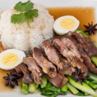 Khao Ka Moo · Slow cooked pork hock in five spices, served with steamed Chinese broccoli, boiled egg and J...