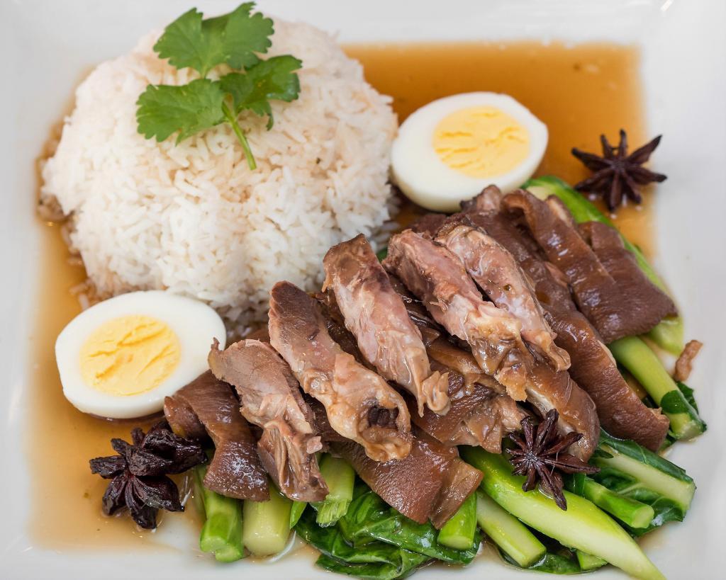Khao Ka Moo · Slow cooked pork hock in five spices, served with steamed Chinese broccoli, boiled egg and Jasmine rice or Brown rice.