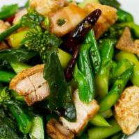 Kana Fai Dang · Chinese broccoli woked in garlic and soy bean past.  Adding salty fish or crispy pork is rec...