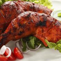 35. Chicken Tandoori · Chicken leg quarters with mild spices cooked in a clay oven.