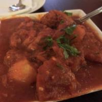 65. Chicken Vindaloo · Boneless chicken chunks cooked with potatoes in spicy sauce.