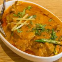 79. Goat Rogan Josh · Goat meat cooked in thick special sauce layered with a slick of oil on top.
