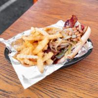 District Dog · Bacon wrap topped with baked beans, BBQ, bacon and sauteed onions.