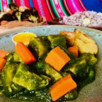 Seco de Pollo: Green Herb Chicken · Chicken, kabocha-coriander sauce, yucca, yams. It comes with Andean rice (rice with quinoa a...