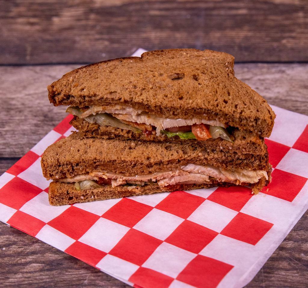Turkey and Cheese Sandwich · Smoked turkey breast with cheese, lettuce and tomato.