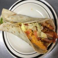 34. Chicken Soft Taco · One fresh flour tortilla stuffed with lettuce, tomato and cheese (Salsa on the side)