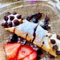 Chocolate Chip Cannoli · Housemade shell stuffed with chocolate chips, powdered sugar and chocolate syrup and sweeten...